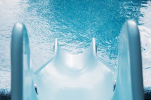 Blue Swimming Pool With Water Slide For Background, High Resolut