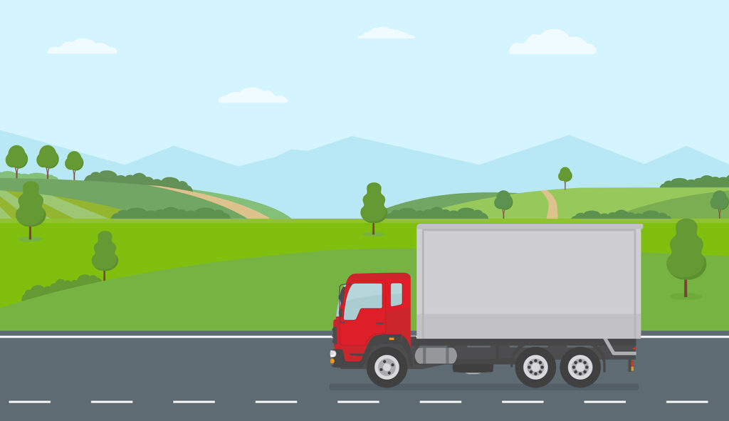 Truck Moving On Asphalt Road Along The Green Fields In Rural Lan